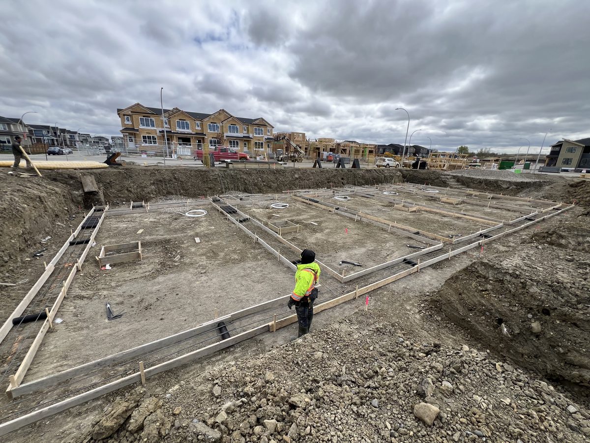 Multi-family townhome footings formed across a full excavation with crew on site